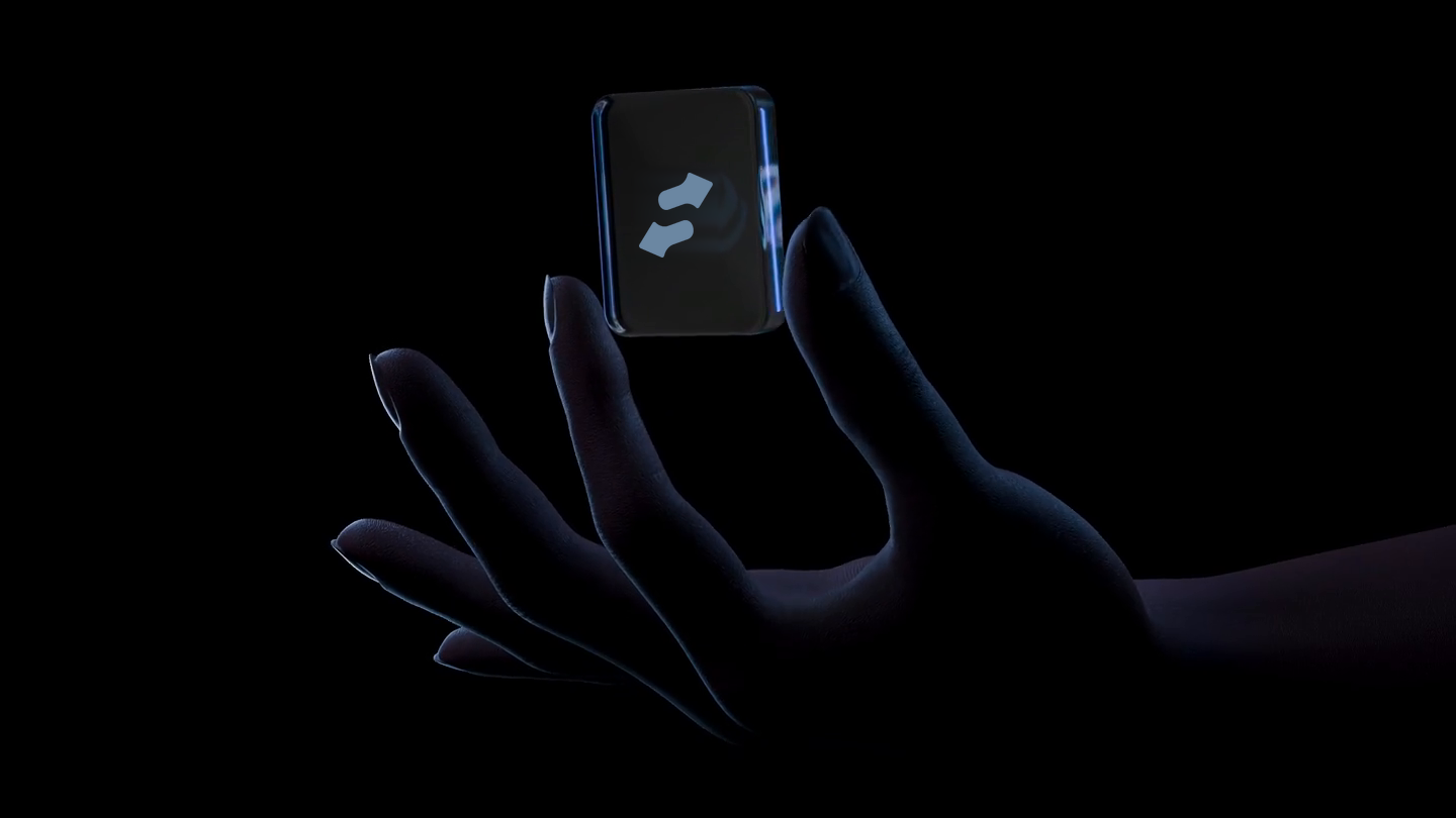 Hand holding a dark card with the stonk.fun logo